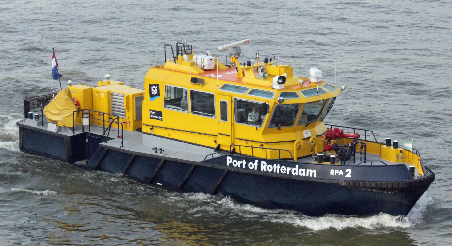 Rotterdam harbour quays, ships and working port waterfront